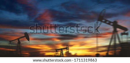 Oil derricks against the sky. Oil rig pump double exposure