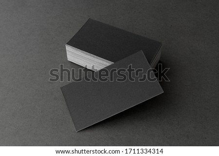 Business card on black background.