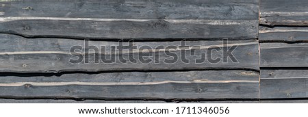 Fence made of black boards in a private house