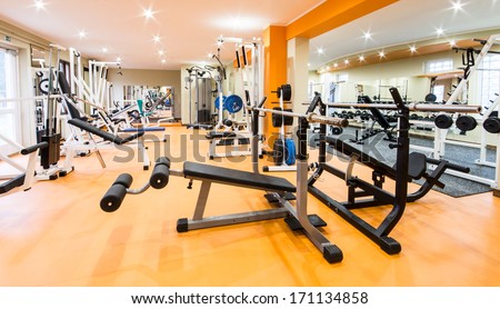 Interior view of a gym with equipment. Royalty-Free Stock Photo #171134858