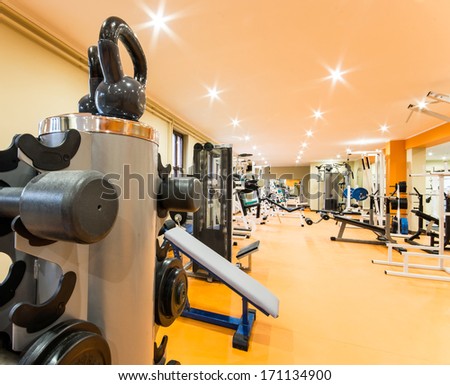 Interior view of a gym with equipment. Royalty-Free Stock Photo #171134900