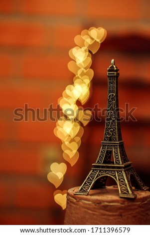 miniature eiffel tower with bokeh hearts