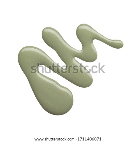 Blot of grey green nail polish isolated on white background. Photo. Top view Royalty-Free Stock Photo #1711406071