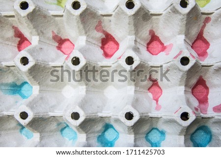 closeup shot with colorful cardboard container with chicken eggs