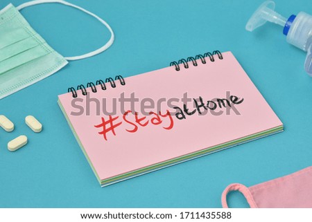 covid-19 coronavirus "STAY HOME / STAY AT HOME" viral social media message sign with text for social distancing awareness.