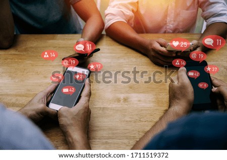 group friend people hands using phone for social network sitting with virtual icon on table at home office, digital technology, social media, internet, networking connection and relationship concept
