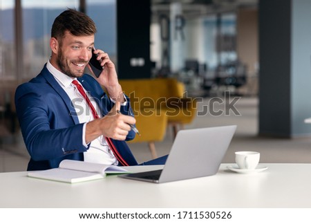 Bearded businessman having an online conference meeting.