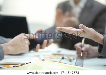 Close up of business people using smartphone. Business concept Royalty-Free Stock Photo #1711549873