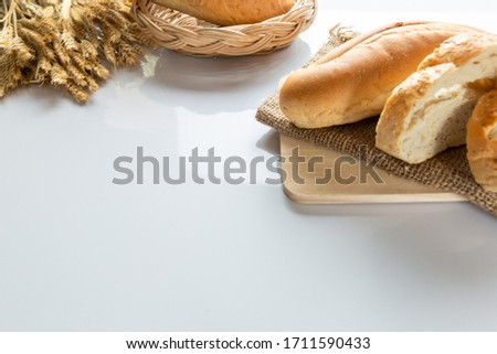Bread in stock on a white table.