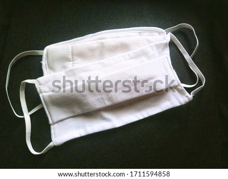 The cloth face masks made of double layer cotton and muslin can be washed and reused many time for wearing to protect against viruses and the others when out in public, new normal.