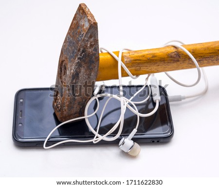 Photo of a hammer and phone