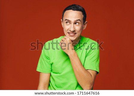 The guy in the green T-shirt on a red background