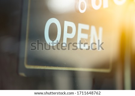 Open signboard on a door at coffee shop. Open and close label concept
