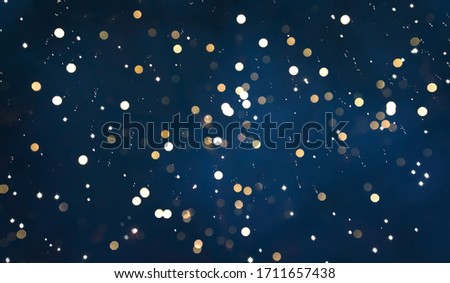 Festive Beautiful Navy Blue Background with bokeh lights. Winter Christmas Holiday Texture. Backdrop for design greetings cards, invitations, or promotion flyers.