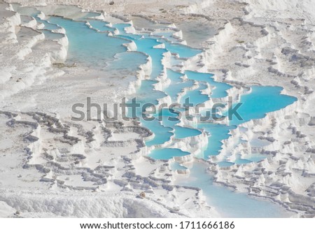 Pamukkale, Turkey - one of the most famous attractions of Turkey, Pamukkale is a Unesco World Heritage site. Here in particular the white travertine terraces Royalty-Free Stock Photo #1711666186