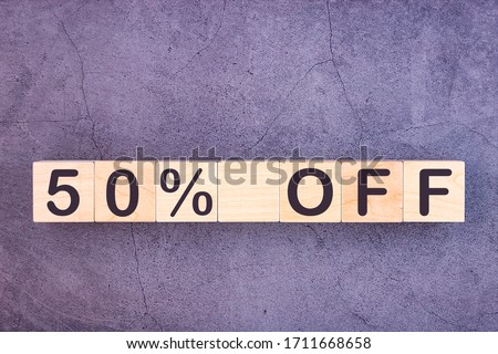 50 percent off text made with wood building blocks.