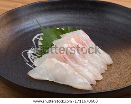Red sea bream sashimi on a plate. Royalty-Free Stock Photo #1711670608