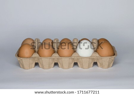 Chicken and duck eggs are packed in a paper product box.