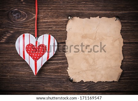 Old paper with heart and place for congratulations Valentine