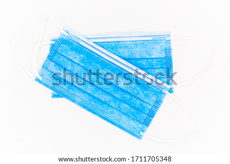 Photography of disposable medical blue mask