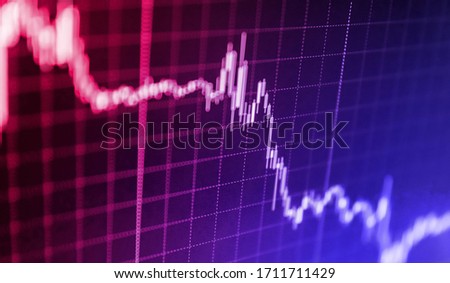 Stock market on digital tablet screen. Financial accounting stock market graphs and charts analysis. Boosting of the stock market. Modern business lifestyle. Stock market graph with screen