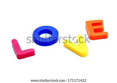 Plastic letters forming word LOVE isolated on the white background