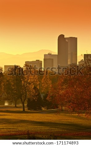 Sunny Denver Sunset. Denver Skyline with Mountains in Background. Denver, Colorado, United States.