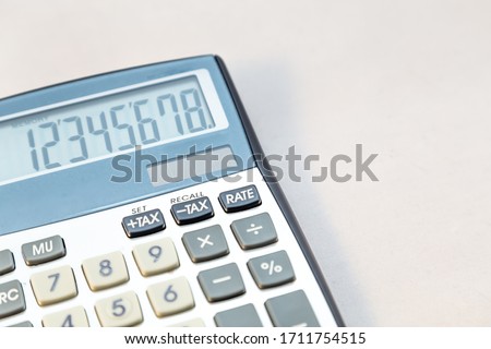 Old electronic calculator on white background