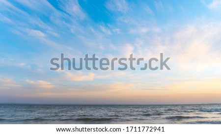 sunset on the sea. view from the shore Royalty-Free Stock Photo #1711772941