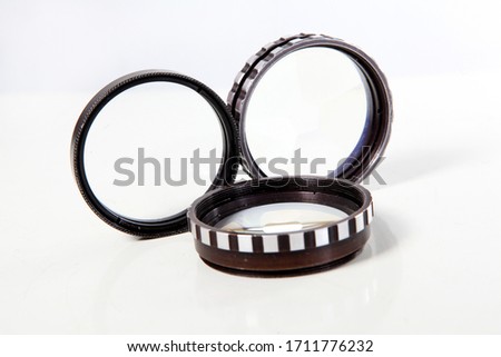 iron-framed lenses on a white background