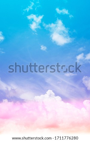 Colorful sunny blue sky with gradient pink, purple, orange color with white fluffy cloud on bright sunny horizon at twilight sunset or morning sunrise in tropical summer or spring sunlight & sun ray  