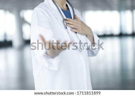 Doctor offering helping hand.Medical help, countering viral infection and medicine concept Royalty-Free Stock Photo #1711811899