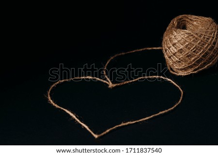 heart shaped rope on a dark background