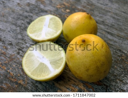 sliced lemon with a textured old wooden background