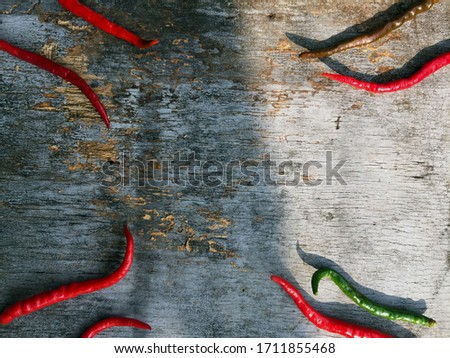 arrangement of red chili on an old table, textured background