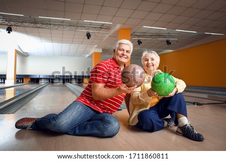 Portrait of senior couple in bowling club