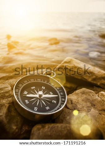 compass on the bank with sunflare Royalty-Free Stock Photo #171191216