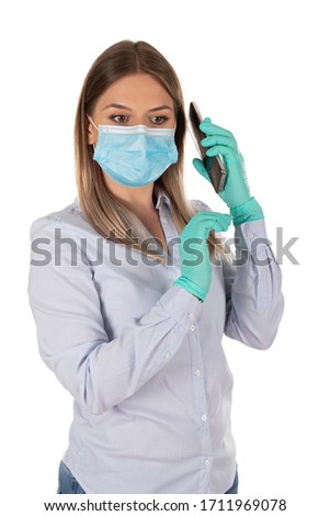 Caucasian woman with surgical mask and gloves having a business call on isolated background 