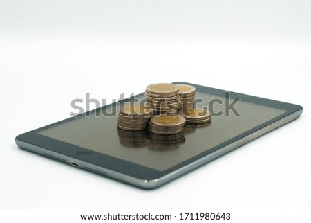 Money coin on the phone on a white background