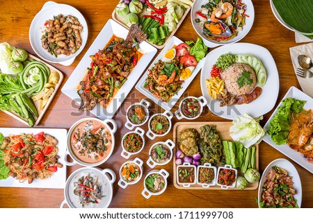 Many kinds of local Thai food Ready-to-eat tableware Family Menu Royalty-Free Stock Photo #1711999708