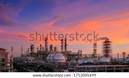 Oil and gas refinery plant or petrochemical industry on sky sunset background, Factory with evening, Manufacturing of petrochemical industrial Royalty-Free Stock Photo #1712005699