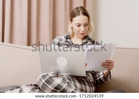 Young beautiful girl in checkered pajamas outlines a lecture