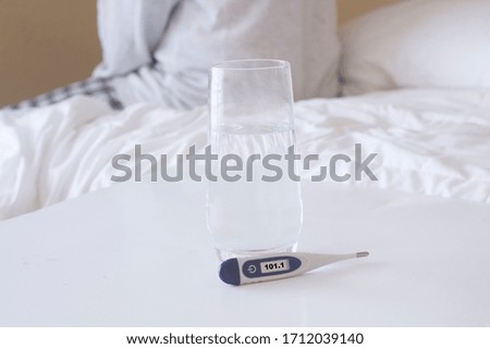 In bed with a high temperature showing flu or corona virus