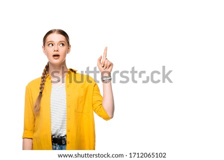 attractive girl with braid and open mouth showing idea gesture isolated on white