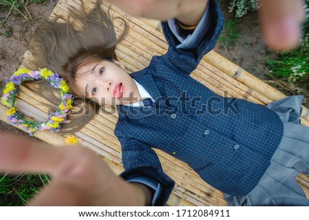 Beautyful Asian woman taking a selfie in public park