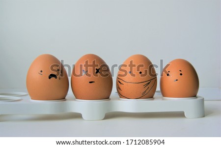 a group of four sad faced eggs  during pandemic virus illness 
