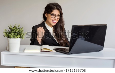Happy Young Woman in front of the Laptop ,Working from Home