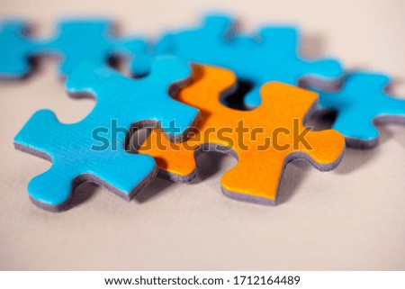 Puzzle jigsaw pieces in blue and orange