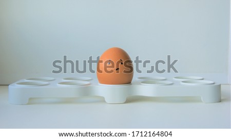One boiled sad faced egg 