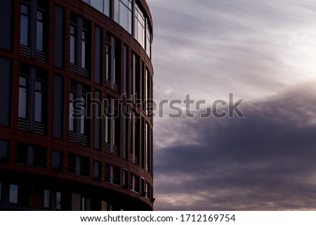 The modern facade of the office building is an abstract fragment, with shiny Windows in a steel structure. Great background for a business card, flyer, banner with space for an inscription or logo